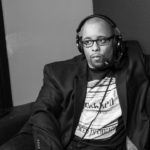 dynamite dan mid-commentary on a couch at low kick