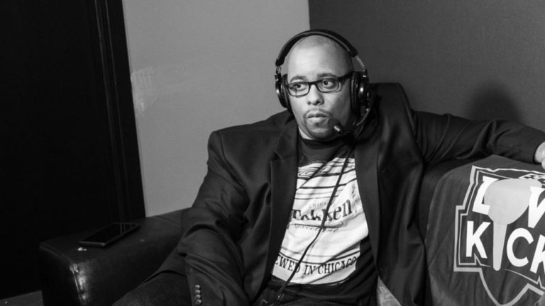 dynamite dan mid-commentary on a couch at low kick